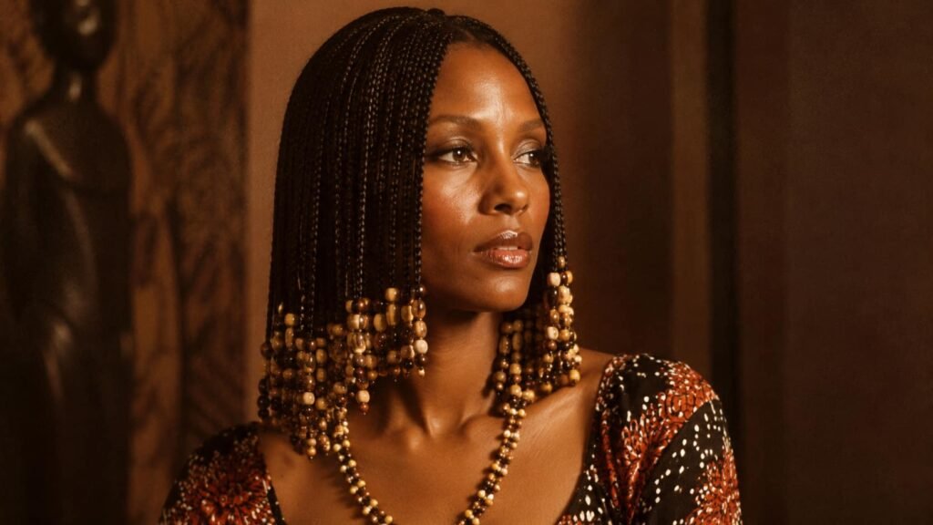 Woman with braided 70s hairstyle decorated with beads