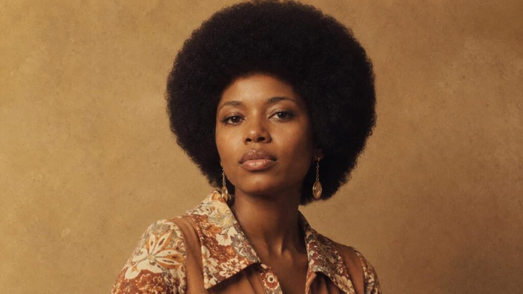 Woman with a full natural Afro hairstyle inspired by the 1970s