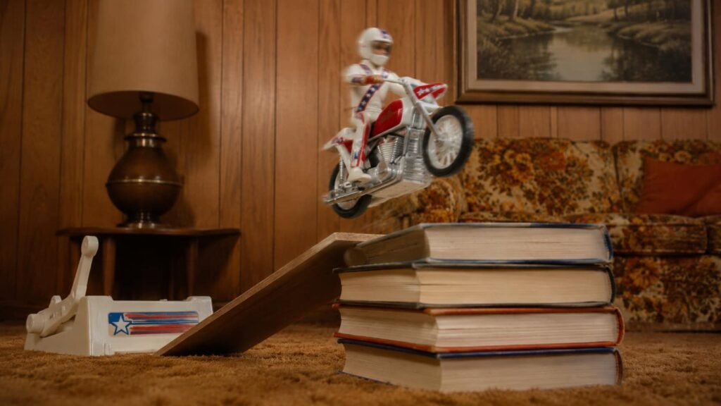 Evel Knievel stunt motorcycle toy jumping from a homemade ramp
